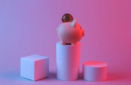 Piggy bank with bitcoin and geometric shapes in red blue neon light. minimalism. Abstract background, concept artの写真素材