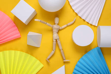 Wooden puppet on abstract background with geometric shapes. minimalism. concept art. creative layout