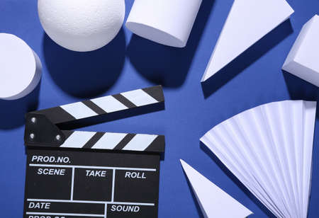 Minimalism blue background with geometric shapes and clapperboard. trendy shadowsの写真素材