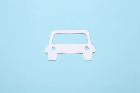 Paper-cut car on blue background.の写真素材