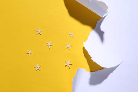 Summer, beach vacation minimalistic background with starfishes and torn paper. trend shadowの写真素材