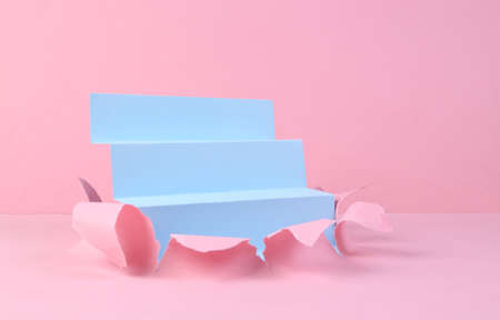 Blue staircase through torn pink pastel paper. minmalism. creative background
