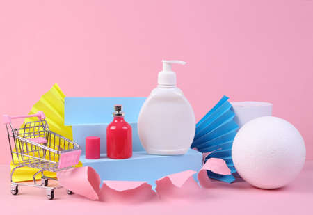 beauty product. shopping. Perfume bottle and perfume bottle on pink torn background with geometric shapes. minmalism. concept artの写真素材