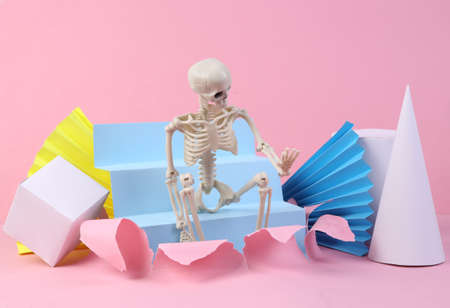Skeleton on pink background with geometric shapes. minmalism. concept artの写真素材