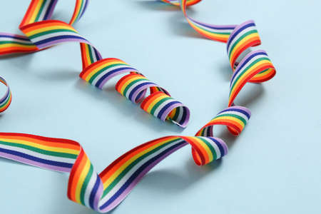 Rainbow lgbt ribbon on blue background