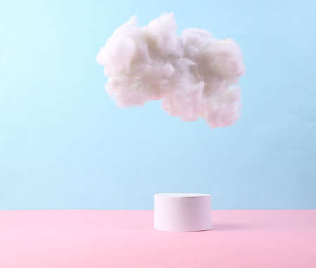 Minimalistic showcase from podium and cloud on a blue-pink pastel background. creative background.の写真素材