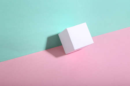 Cube on blue-pink background. minimalism. trendy shadow. creative layout.