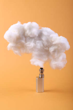 Skeleton hidden behind a cloud sits on a beige background. concept art. Minimalism fashion or...