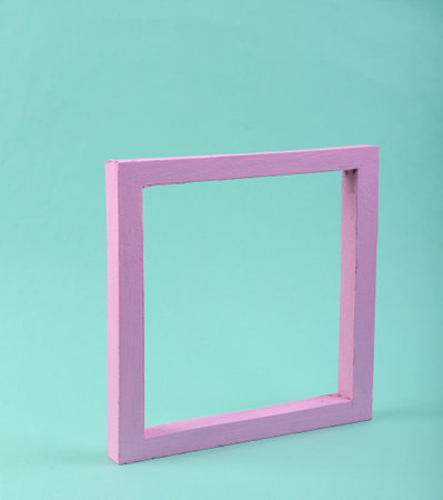 Pink frame on a blue background. minimalism. pastel color trendsの写真素材