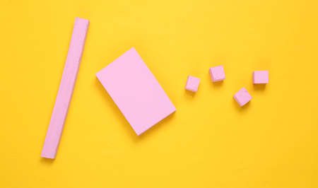Layout composition of pink geometric shapes on yellow background. flat layの写真素材