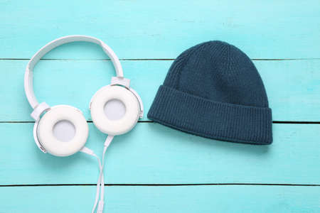 Beanie and headphones on a blue wooden backgroundの写真素材