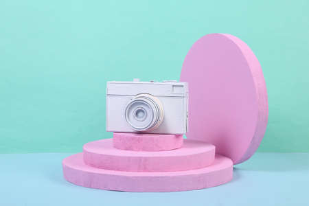 White camera on pink podium. concept art. creative layout. minimalismの写真素材