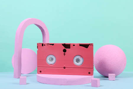 Pink video cassette on the podium with geometric shapas. concept art. Fashion Minimalismの写真素材