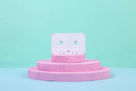 White audio cassette on pink podium. concept art. Fashion Minimalismの写真素材