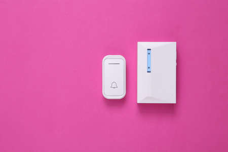 Doorbell on pink background. minimalism