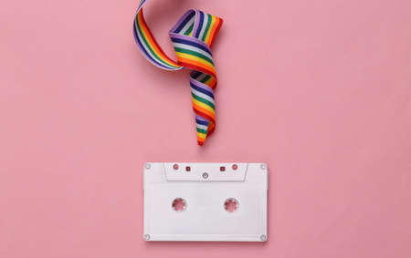 White painted camera and rainbow tape on pink background. minimalismの写真素材