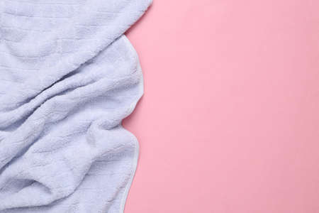 Blue towel on pink background. top view. copy spaceの写真素材