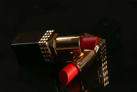 Red lipsticks on black backgroundの写真素材