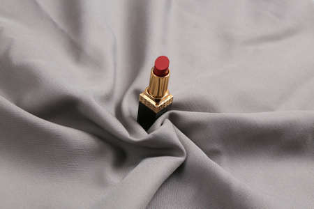 Lipsticks on gray silk background. beauty and fashion still lifeの写真素材