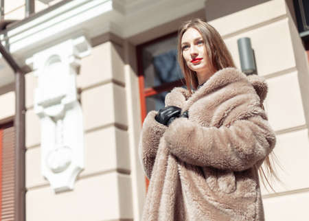 Portrait of a fashion woman in luxurious fur coatの写真素材