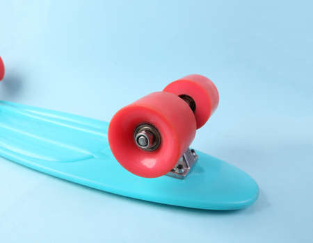 Close up penny board wheel on blue backgroundの写真素材