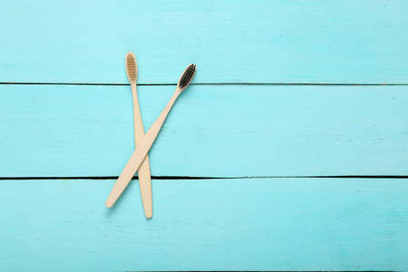 Eco bamboo toothbrushes on wooden tableの写真素材