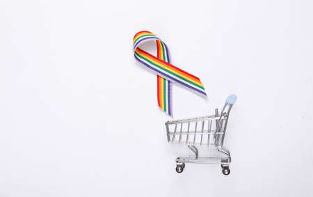 LGBT rainbow ribbon pride tape symbol and shopping trolley on white background.の写真素材