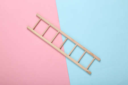 Wooden staircase on a blue-pink pastel background. top viewの写真素材