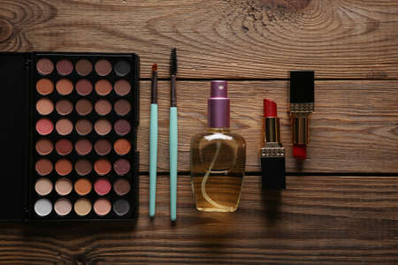 Set of cosmetics on a wooden background. Women's makeup accessoriesの写真素材