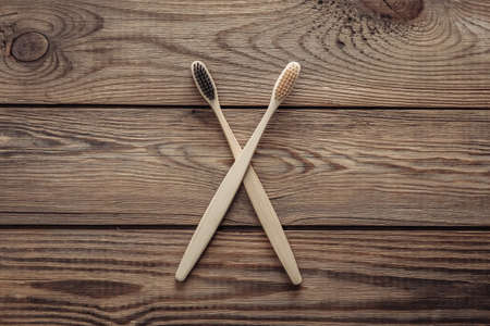 Eco bamboo toothbrushes on wooden background