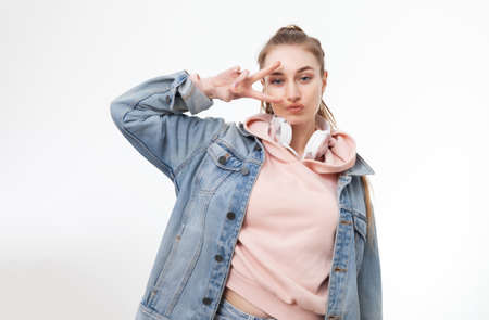 I have a fun. Portrait of a young cheerful woman on a white background