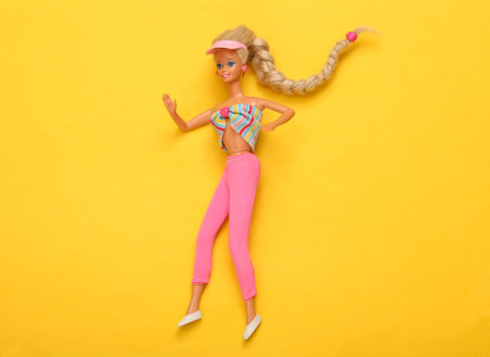 ODESSA, UKRAINE - JUNE 1, 2021: Barbie Doll on yellow background