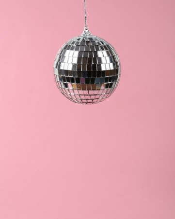 Disco ball on a pink background. Minimalist party conceptの写真素材