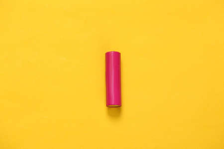AA battery on yellow background. minimalismの写真素材