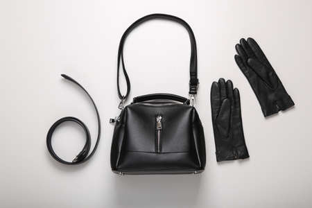 leather accessories. Leather bag, belt and gloves on white background. top viewの写真素材