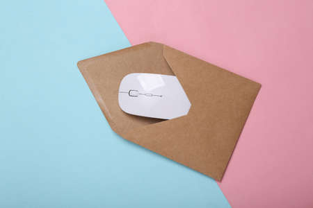 Envelope with pc mouse on blue-pink pastel background. Email
