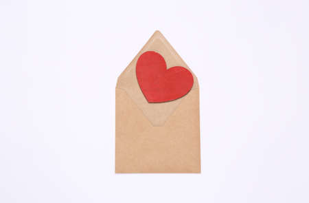 Envelope with red heart on white background. love conceptの写真素材