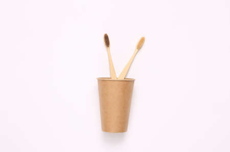 Plastic free toothbrushes in a cup. Zero waste, eco friendly concept. flat lay.