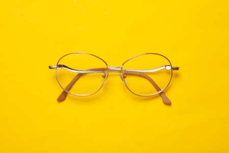 Optical eye glasses on yellow backgroundの写真素材