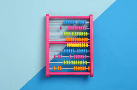 Childrens toy abacus on blue backgroundの写真素材