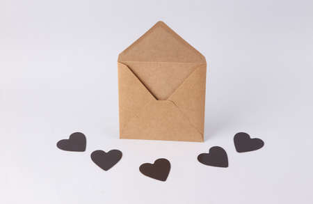 Envelope with black hearts on a white background. Romantic, valentine's day conceptの写真素材