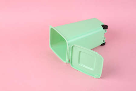 Empty toy trash can on pink backgroundの写真素材