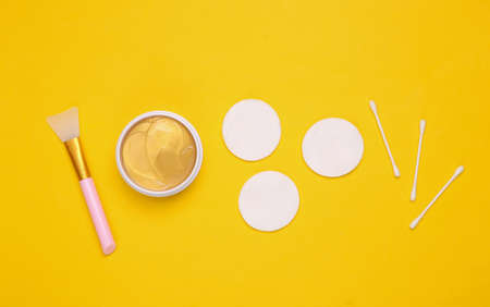 Facial care products on yellow background. top viewの写真素材