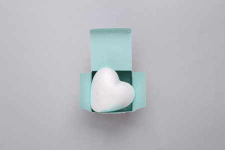 Box with hearts on a gray backgroundの写真素材