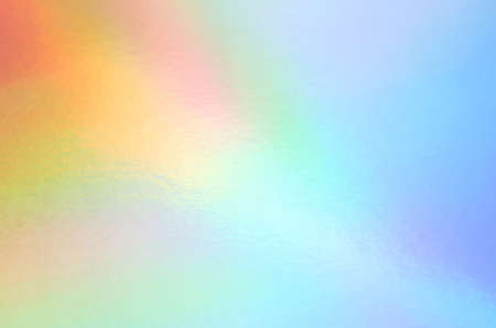 Background of holographic iridescent multicolored surfaceの写真素材