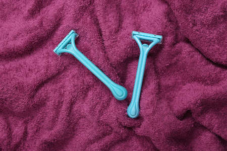Shaver epilators on a towel close-up. Personal care, hygieneの写真素材