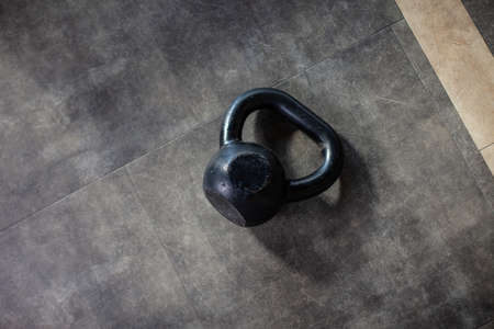 Kettlebell on the gym floor. Bodybuilding and Fitnessの写真素材