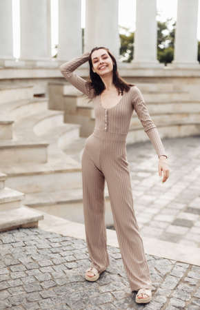 Cheerful young woman having fun in the city.の写真素材