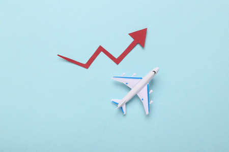 Airplane model with growth arrow on blue background