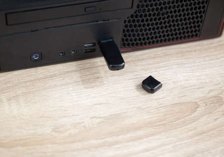 USB flash drive inserted into the computer on the table